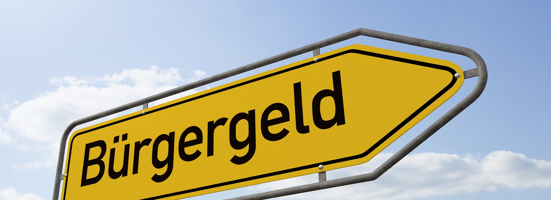 Das Bild zeigt ein gelbes Straßenschild mit dem Schriftzug Bürgergeld.